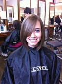 Slight asymmetrical bob with short fringe in front...over 7 inches cut off! 