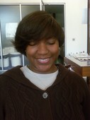 A different take on an asymmetrical cut...her natural texture is extra curly!