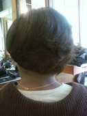 She likes to keep it cute, but simple: the rounded back w/layers adds the edge to a look than can still be conservative :-)